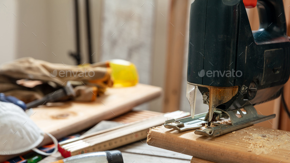 Electric Jigsaw On A Wooden Table. Work Tools Concept. Stock Photo, Picture  and Royalty Free Image. Image 54424086.