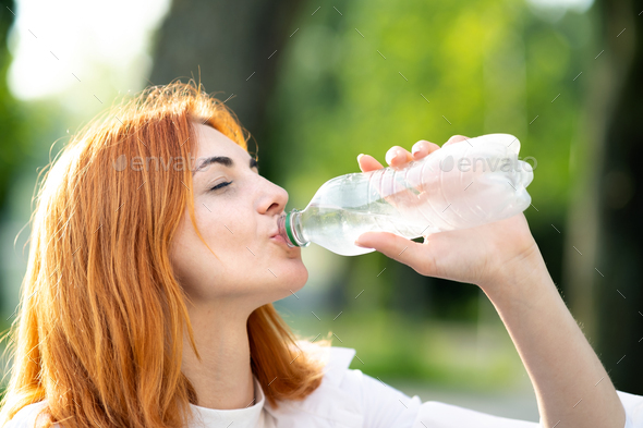 portrait of young sportive teen girl with a bottle of drinking water Stock  Photo