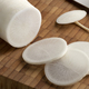 Fresh white daikon radish and slices on a cutting board - PhotoDune Item for Sale