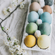Stylish Easter eggs and cherry blossoms on rustic linen cloth. Happy Easter! - PhotoDune Item for Sale