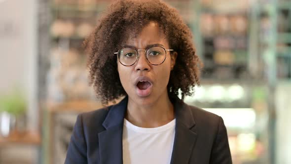 Disappointed African Businesswoman Reacting To Loss  alt