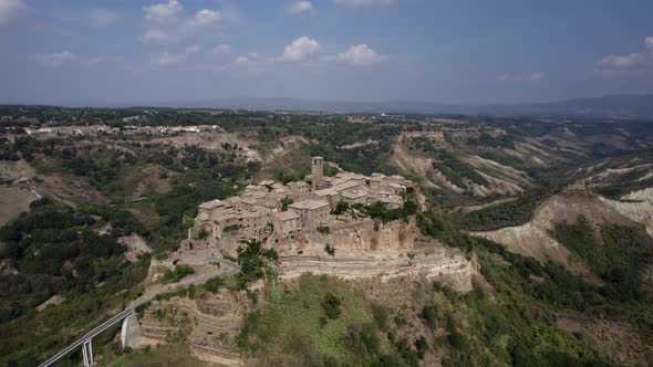 -SHOT: 180º bird's eye view-DESCRIPTION: video with drone over the civita di Bagnoregio, in the Ita alt
