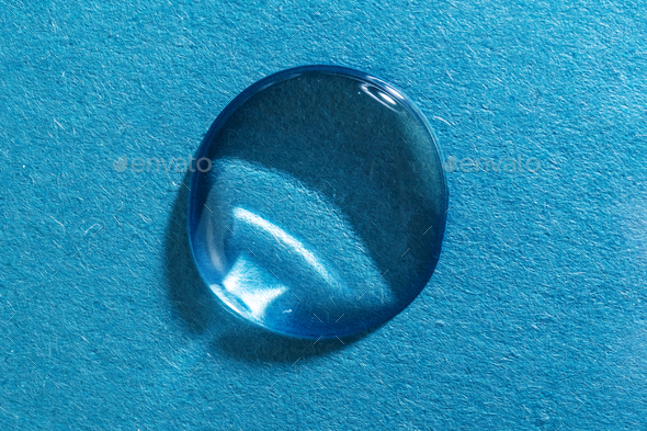 The gel flows over a blue fluted background