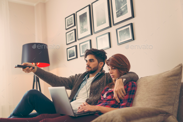 Couple watching TV - Stock Photo - Images