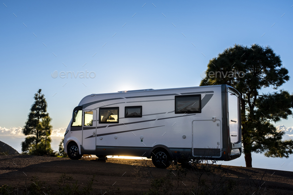 Big camper motorhome parked in off road nature space to enjoy total freedom. Off grid lifestyle