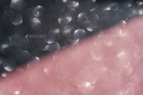 Black and pink abstract glitter background with shiny bokeh