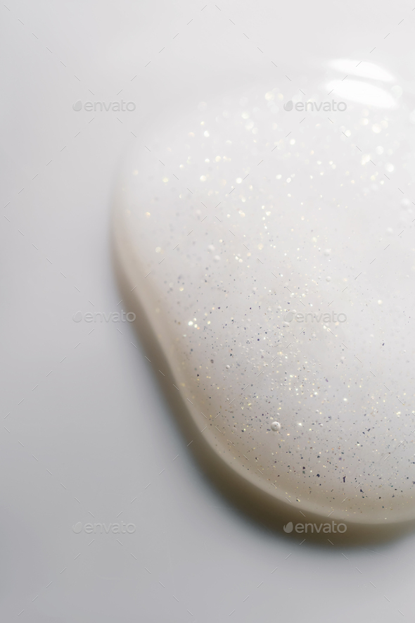 A drop of cosmetic product on a white background.