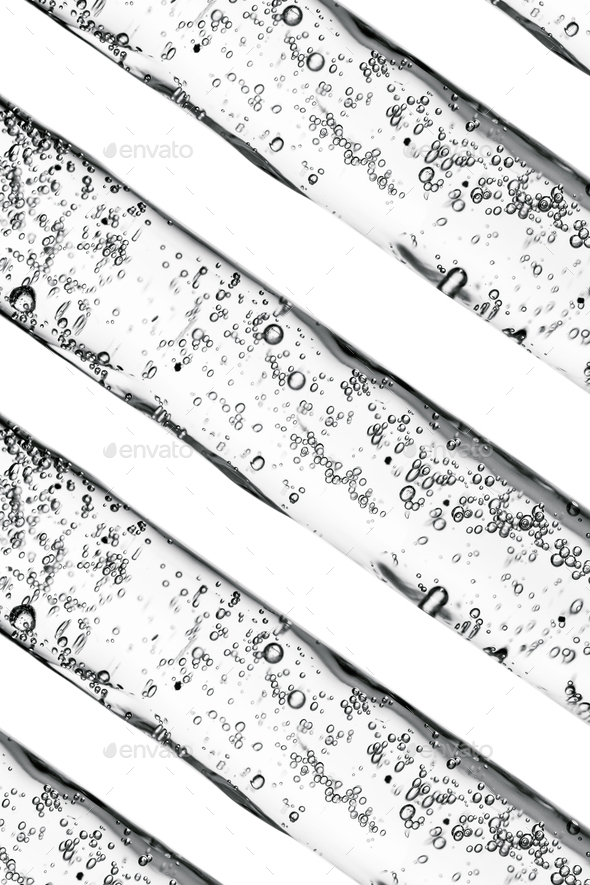 Background of cosmetic pipettes with bubbles close-up.