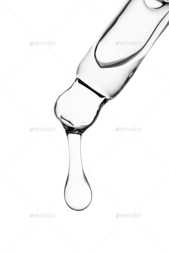 Transparent pipette with cosmetics on a white isolated background.