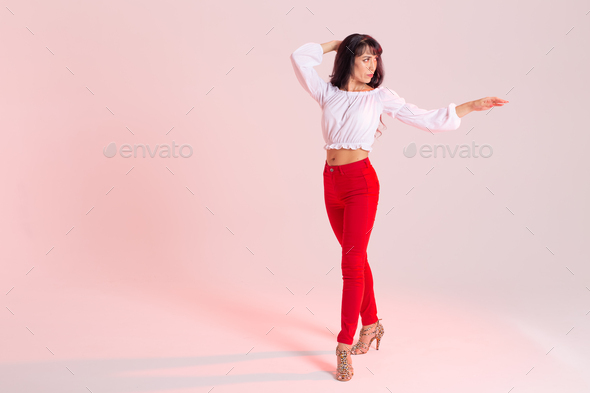Latin dance, bachata lady, jazz modern and vogue dance concept - Beautiful young woman dancing on