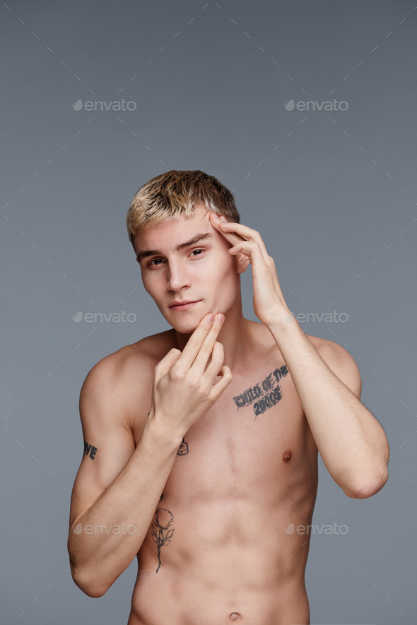 Portrait of Tattooed Young Man Minimal