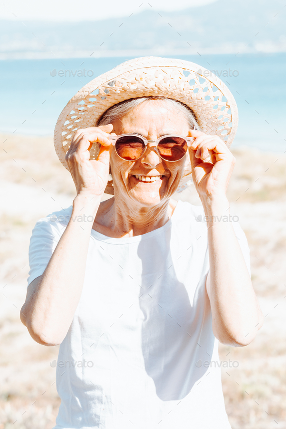 Traveler tourist smiling mature elderly senior lady woman 55 years old ...