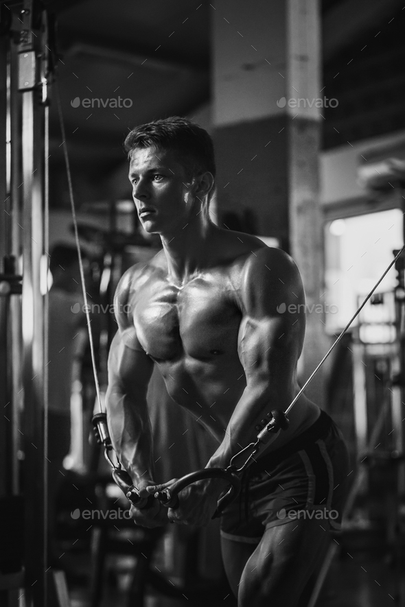 muscular bodybuilder guy workout in gym - Stock Photo - Images