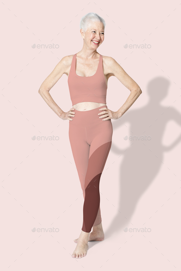 Healthy senior woman in pink sports bra and leggings full body Stock Photo  by Rawpixel