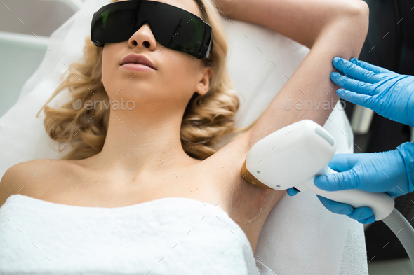 Underarm Laser Epilation Beautician Removing Hair Of Young Womans Armpit Smooth Skin Concept 