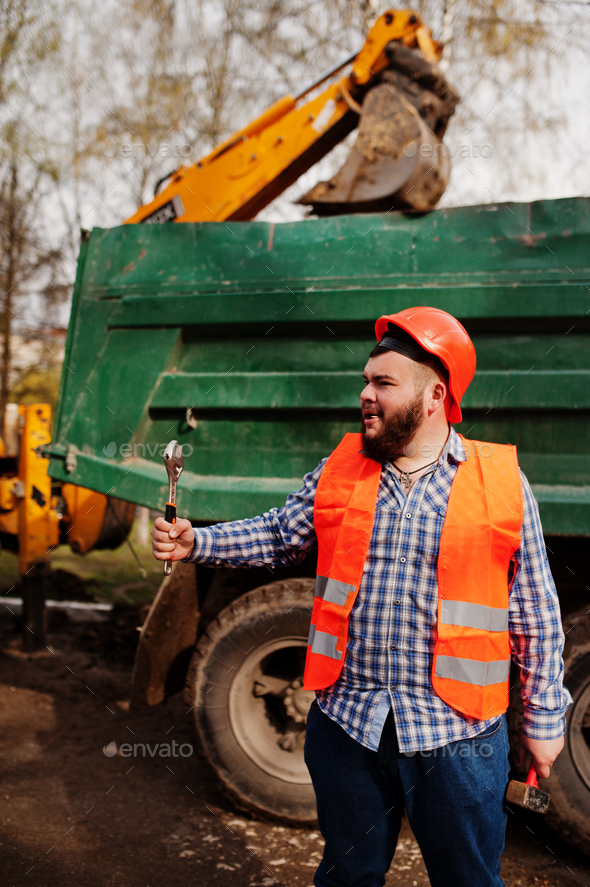 Beard worker man suit construction worker in safety orange helmet