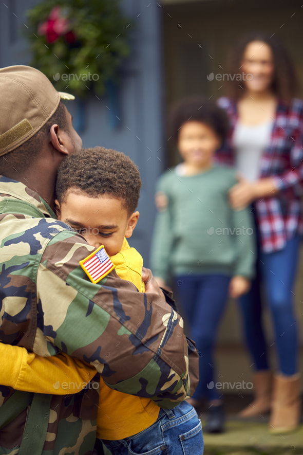 American Soldier In Uniform Returning Home To Family On Hugging ...