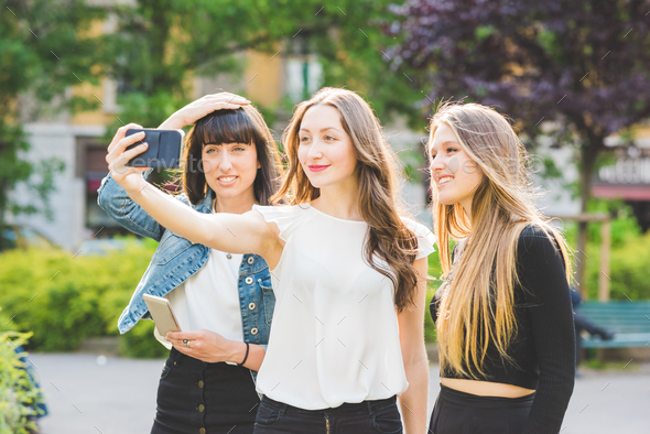 Three young beautiful caucasian young women millennials, taking selfie ...