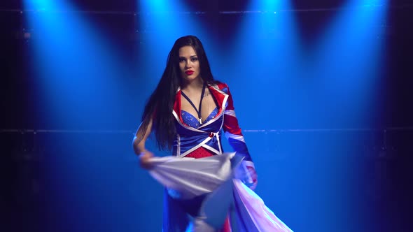 Passionate Girl Dancing in a Sexy Suit in the Color of the English Flag and Rhinestones. Attractive alt