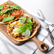 Homemade wheat tortilla with tomatoes, mozzarella cheese, olives and fresh spinach - PhotoDune Item for Sale