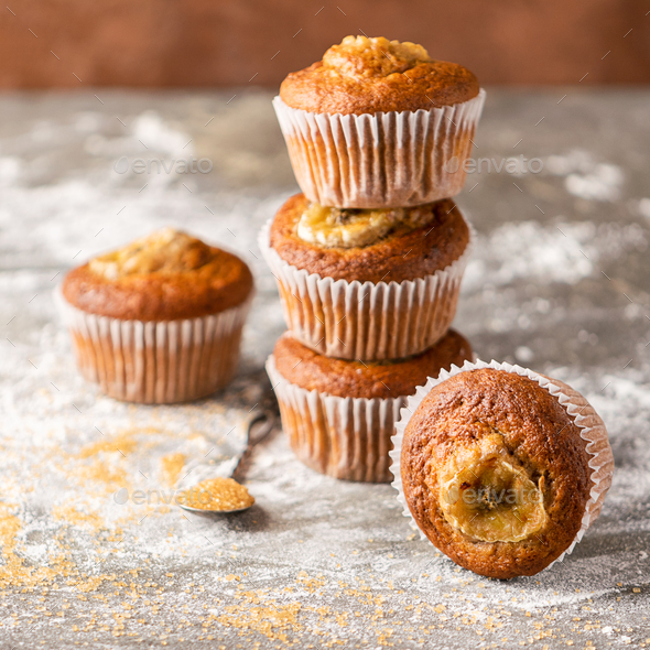 Homemade banana muffins on a gray background. Healthy vegan dessert. Close-up selective focus