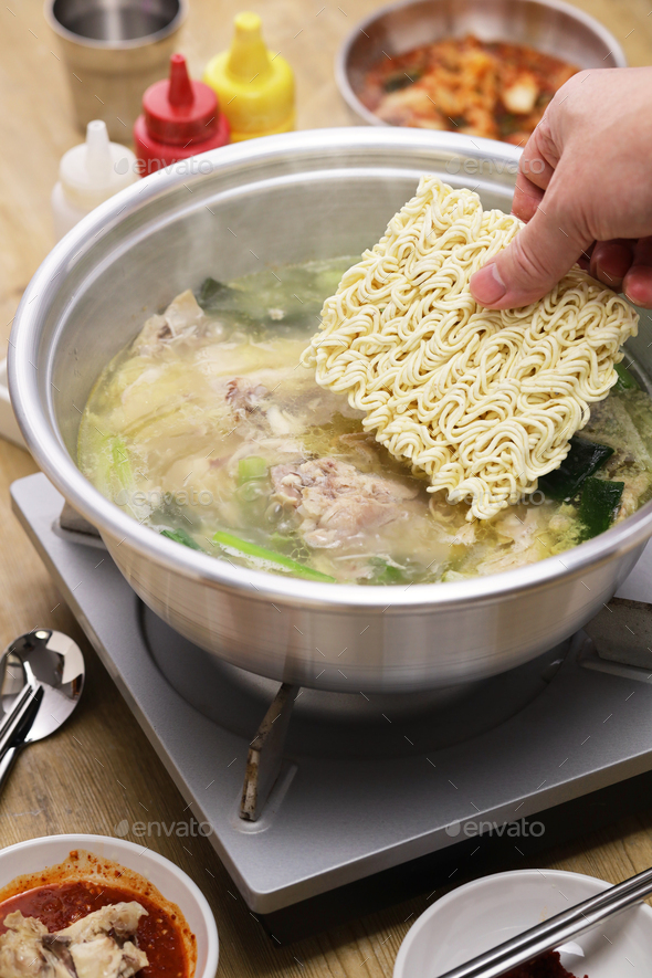korean whole chicken soup hot pot, Instant noodles at the end of the meal. - Stock Photo - Images