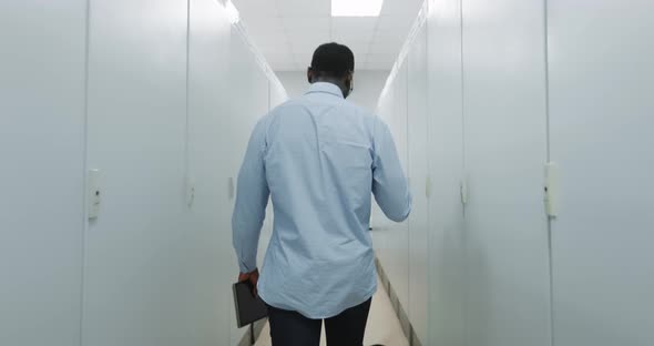 Portrait of an Engineer in a Hard Hat Holding a Tablet alt
