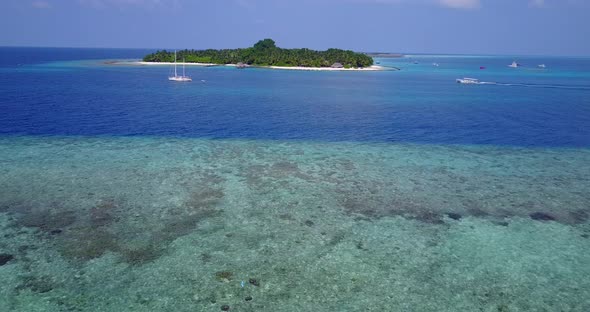 Tropical above copy space shot of a white sandy paradise beach and blue ocean background in vibrant  alt