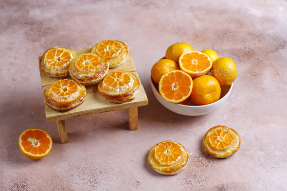 Homemade puff pastry with tangerine slices. Stock Photo by 13people