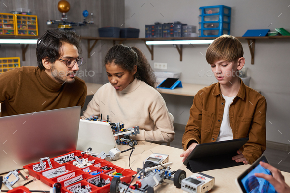 Children working with artificial intelligence - Stock Photo - Images