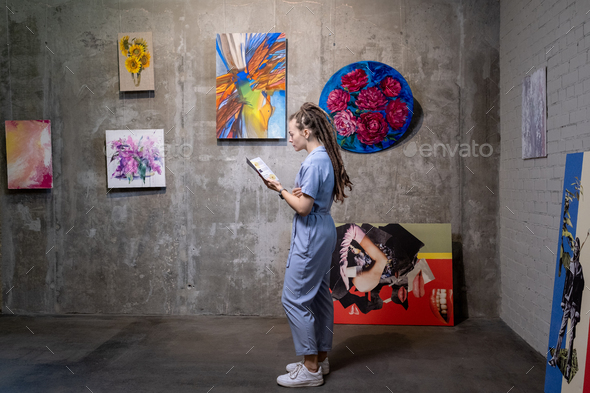 Young woman working in art gallery