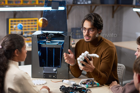 Teacher talking about the artificial intelligence - Stock Photo - Images