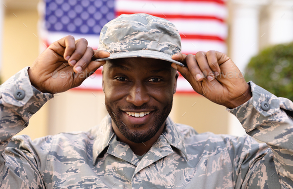 Portrait of smiling male african american army soldier wearing cap and ...