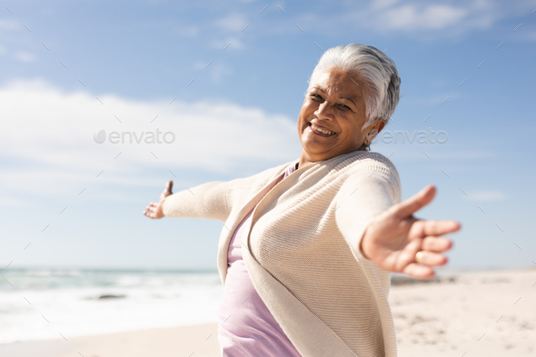 Portrait Of Cheerful Biracial Senior Woman With Arms Outstretched ...