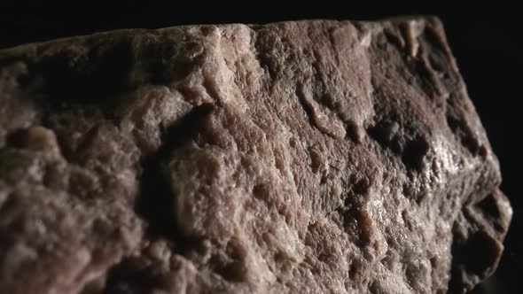 Solid Piece of Granite or Quartz Stone Against Black Background alt