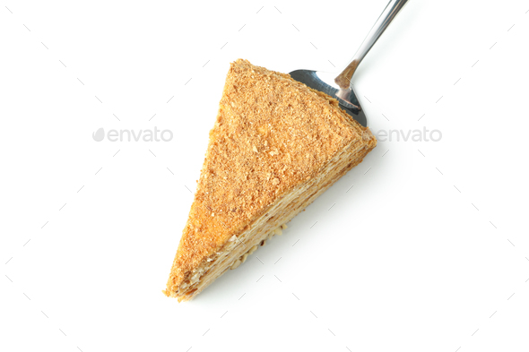 Cake spatula with honey cake isolated on white background