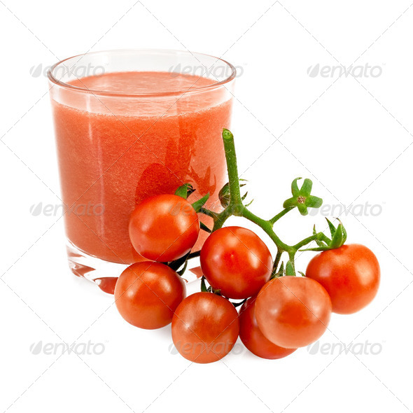 Juice tomato in a glass and a bunch of tomatoes - Stock Photo - Images