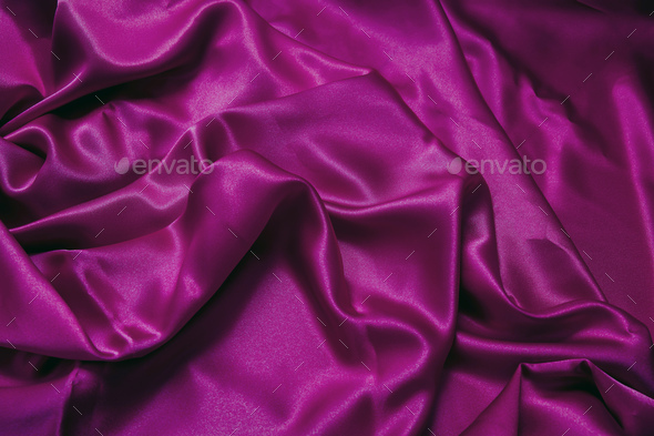 Purple violet silk fabric background, texture. Luxury wavy satin textile  for backdrop. Stock Photo by rawf8