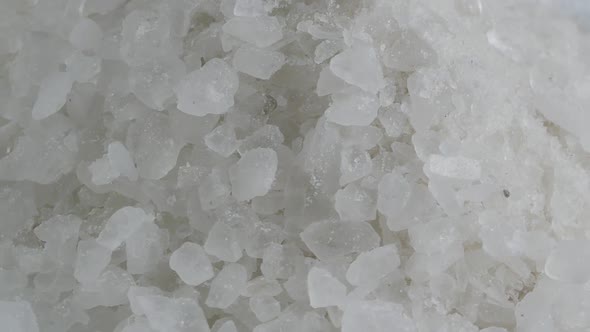 pile of coarse grained sea salt alt
