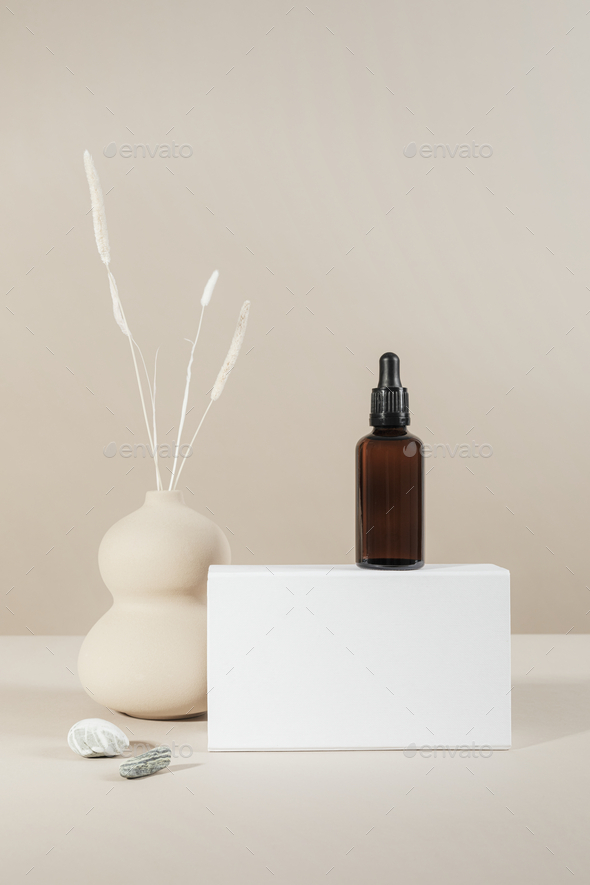 Brown glass dropper bottle with a white box product mockup - Stock Photo - Images