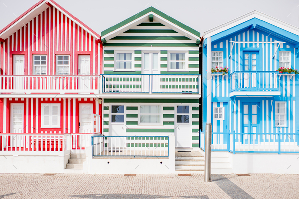 Beautiful colorful houses at the Costa Nova beach in Portugal - Stock Photo - Images