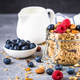 Granola with fresh berries in the glass jar. - PhotoDune Item for Sale