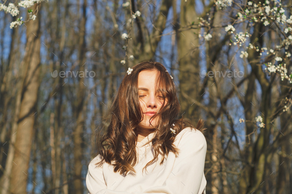 Portrait Of Young Beautiful Woman Among Flowering Trees Fashion And Beauty Spring Concept