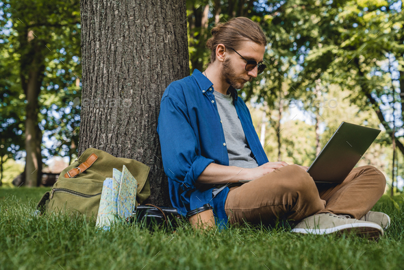 wearing sunglasses while looking at computer