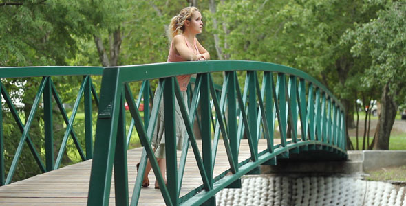 Woman Standing On Bridge