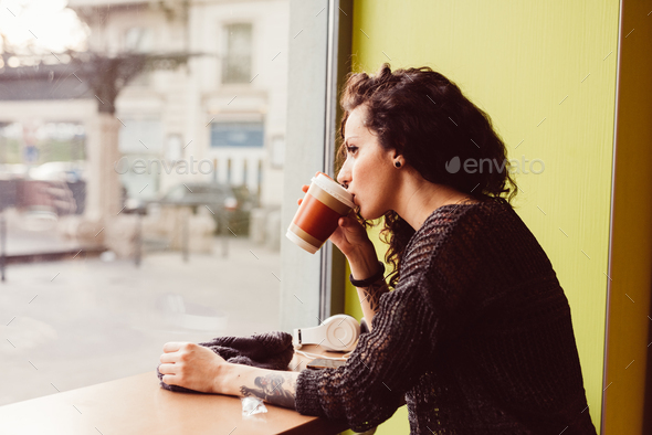 Woman Drinking Coffee Out Of A Paper Cup Stock Photo, Picture and