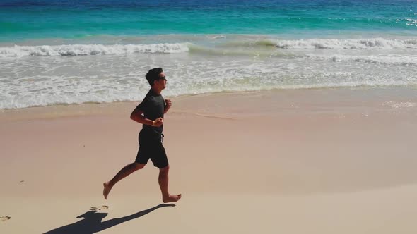 Fitness Man Running Jog On Morning At Sea