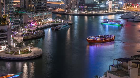 Waterfront Promenade in Dubai Marina Aerial Night Timelapse alt