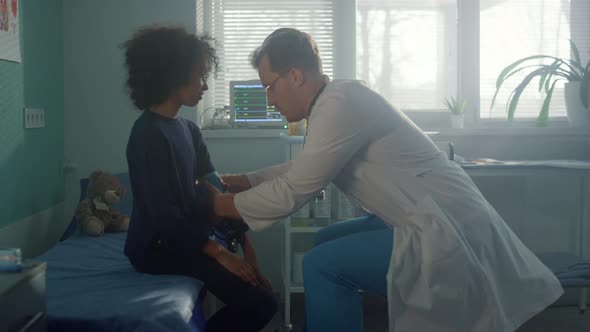 Preteen Child Visit Doctor in Hospital alt