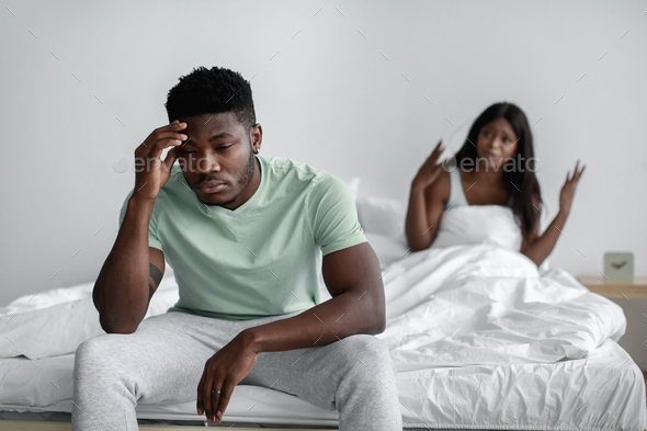 Sad Millennial African American Woman Sits On Bed Swear Her Offended